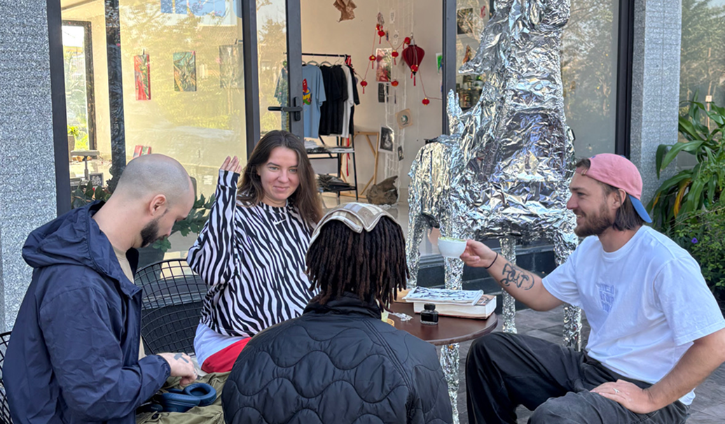 Creative people meeting outside Not From Here gallery